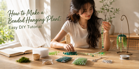 A woman making a green beaded hanging plant DIY kit at a bright craft table beside a sunny window.