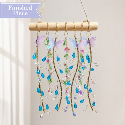 Ocean Willow finished suncatcher with blue teardrop crystals, pastel butterflies, and natural wood.