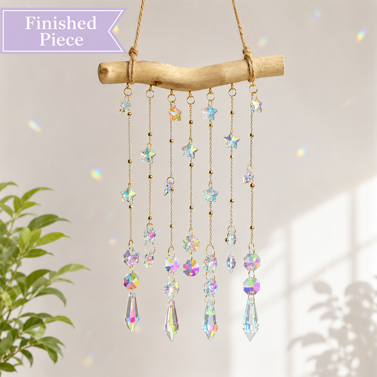 Starlight Driftwood finished suncatcher with iridescent stars and crystal prism drops.