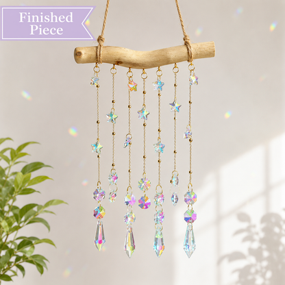 Starlight Driftwood finished suncatcher with iridescent stars and crystal prism drops.