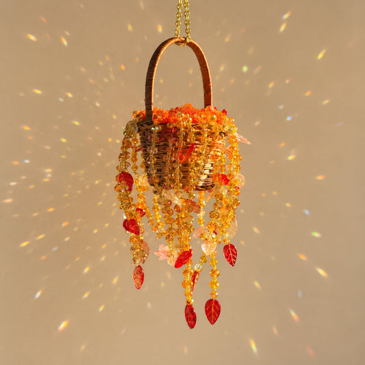 Autumn Dusk beaded hanging basket with amber beads and red leaves