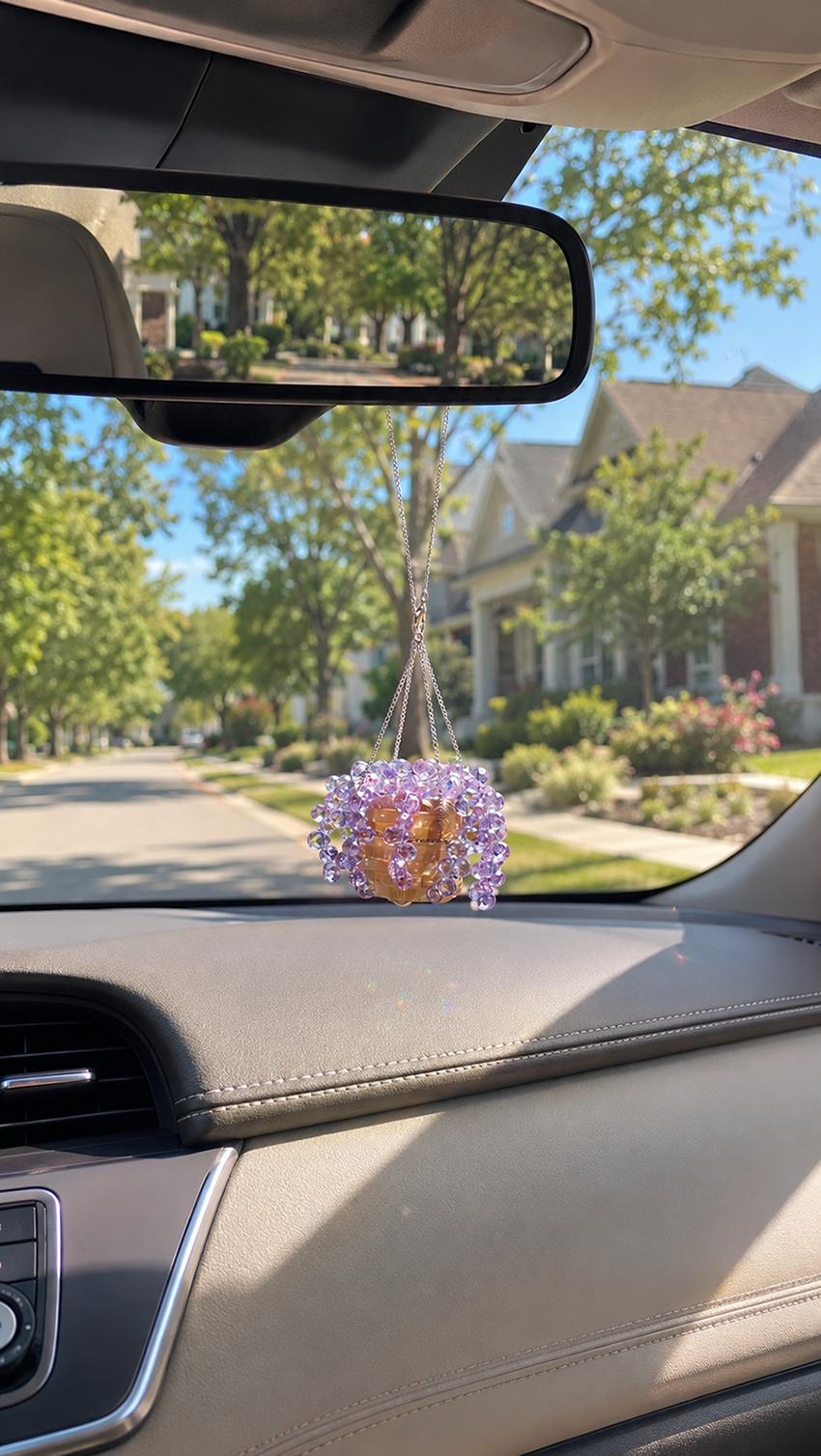 Ready-to-hang mini purple beaded plant car charm displayed inside a car.
