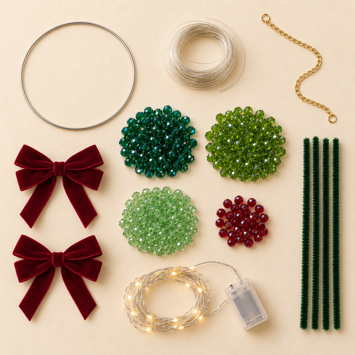 Beaded Christmas wreath DIY kit contents with rings, wire, chain, beads, bows and fairy lights