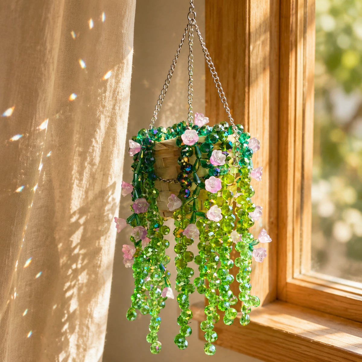 Green and lavender beaded hanging plant beside a sunny cottage window with prismatic reflections