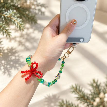 Christmas charm attached to a phone case