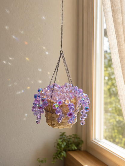 Mini purple Mermaid's Tears finished car charm hanging beside a window with reflected light spots.