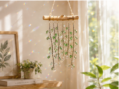 Emerald Willow hanging decor displayed above a light wood table near a bright window.