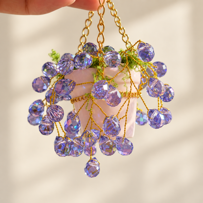 Purple beads and ceramic pot close-up