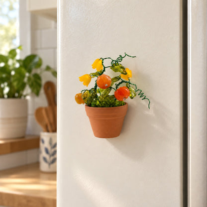 Mini pumpkin and yellow flower beaded plant magnet on a refrigerator door