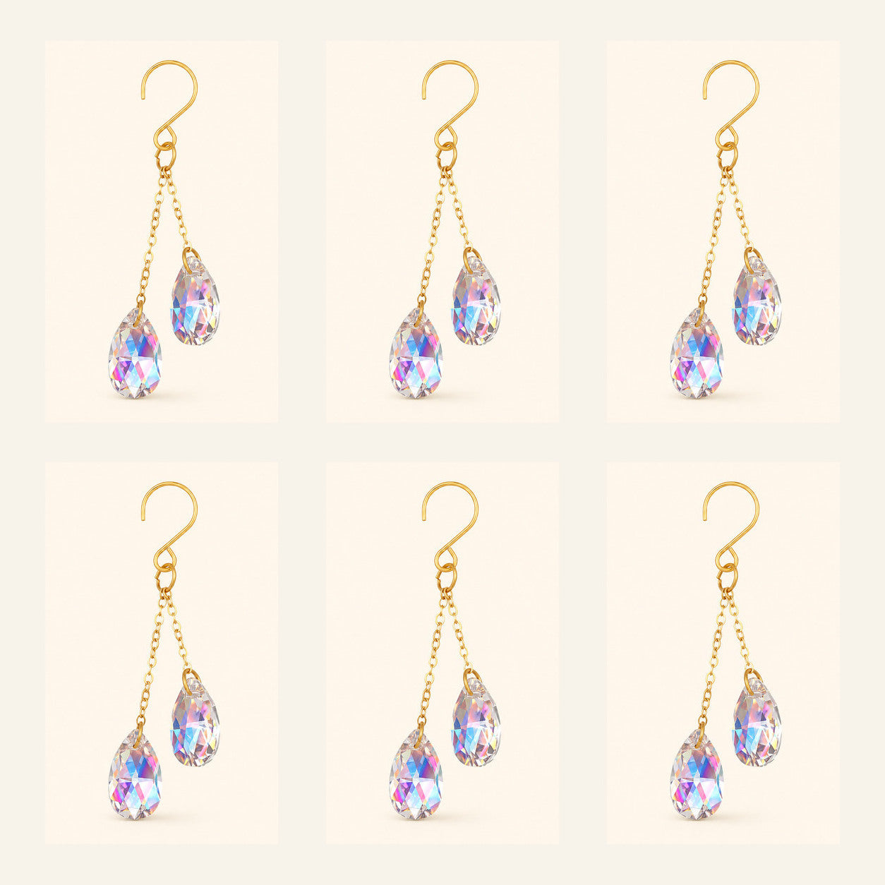 Six AB iridescent crystal plant vine suncatcher charms with gold-tone hooks arranged on a warm ivory background.
