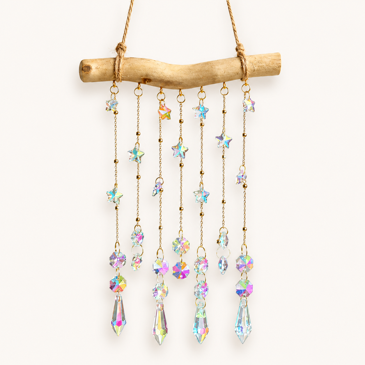 Front view of the Starlight Driftwood crystal suncatcher on a natural wood branch.